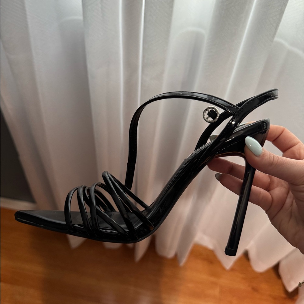 Elegant Black Strappy Heels. Worn 1 time. No rips or tears.